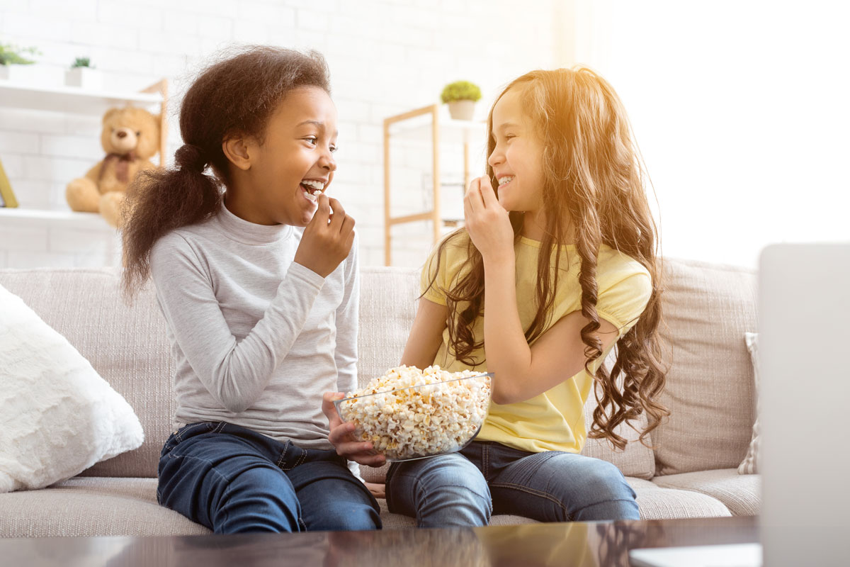 Friends eating popcorn